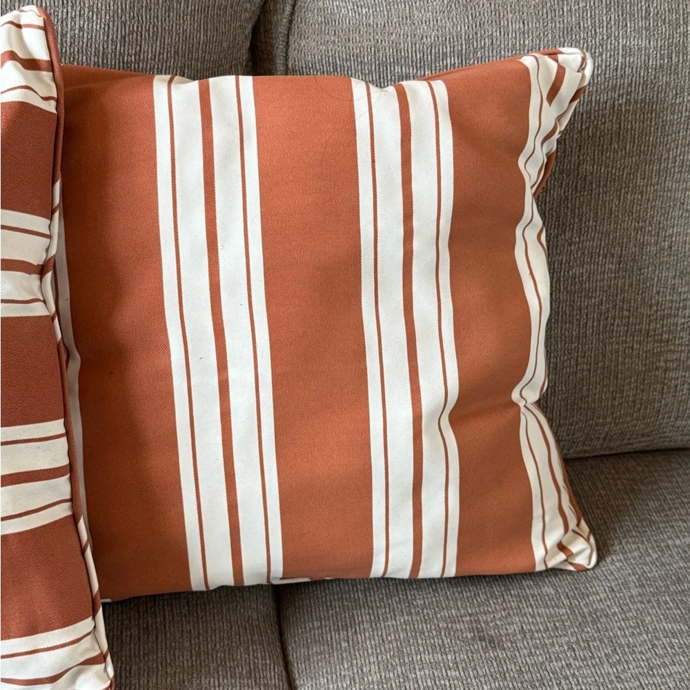 Orange and cream throw pillows